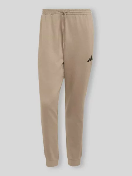 Spodnie dresowe o kroju regular fit z mieszanki bawełny Adidas Sportswear