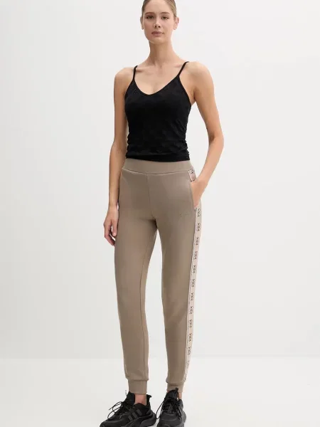 Спортивные штаны Guess с аппликацией розовые