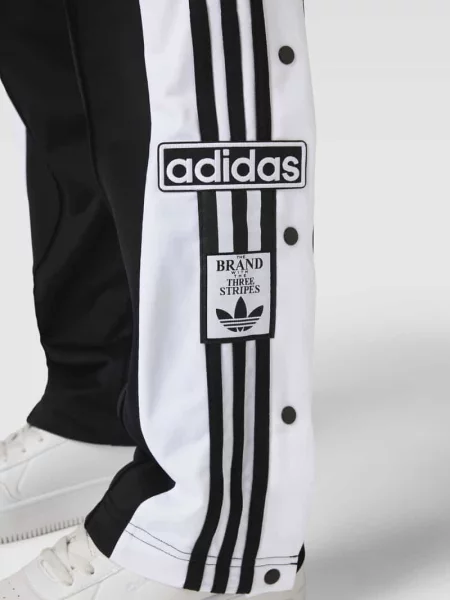 Spodnie dresowe z bocznymi listwami na zatrzaski model ‘ADIBREAK’ Adidas Originals czarny