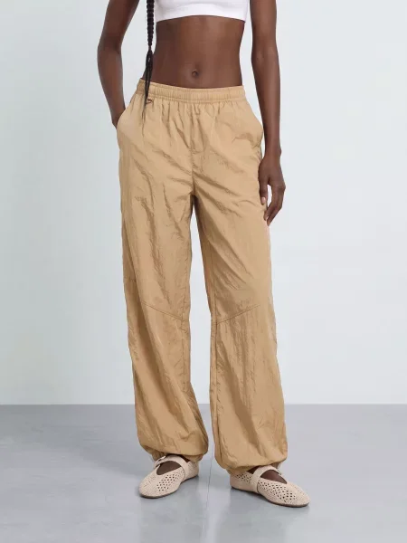 Nike Spodnie Treningowe Sportswear beige białe
