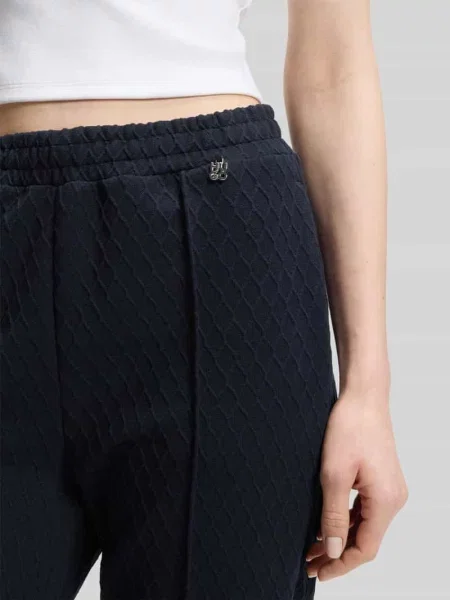 Spodnie o kroju relaxed fit o szerokim fasonie z detalem z logo model NADID' Hugo granatowe