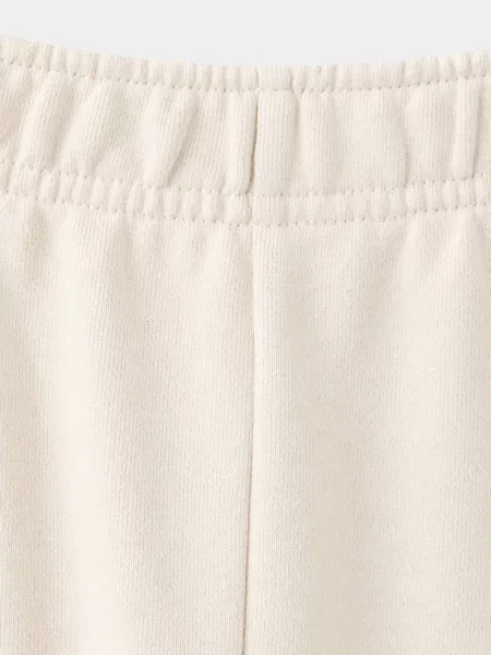 Spodnie jogger z haftowanym kwiatem kremowy / écru Dzieci lata MANGO KIDS