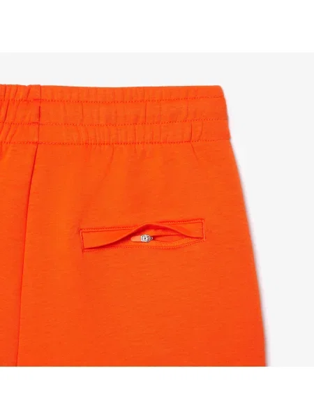Lacoste Spodnie Zwężane pomarańczowe
