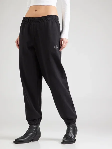 Calvin Klein Jeans Spodnji del trenirke Foil Monologo črna