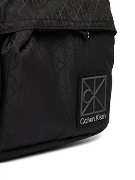Calvin Klein Torbica za okrog pasu﻿ Utility Emblem Sling Waistbag črna