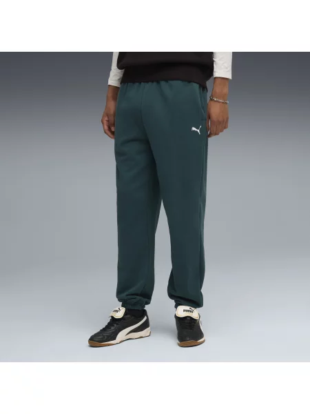PUMA spodnie dresowe o luźnym kroju Wardrobe Essentials Odzież S zielony