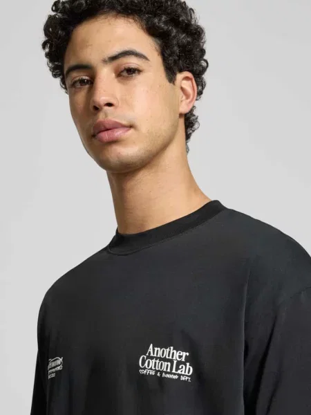 T-shirt z nadrukiem etykiety Another Cotton Lab czarna