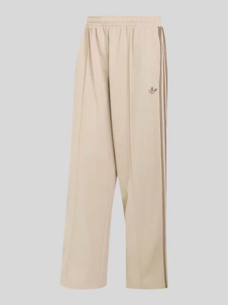 Spodnie dresowe o kroju loose fit z mieszanka bawełny z kantami Adidas Originals