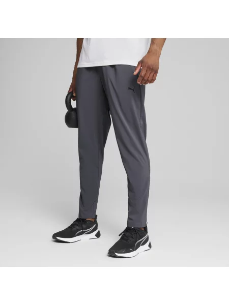PUMA tkane spodnie TAD ESSENTIALS o zwężanym kroju Akcesoria S szary