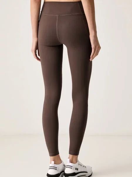 Under Armour legginsy sportowe Motion brązowe