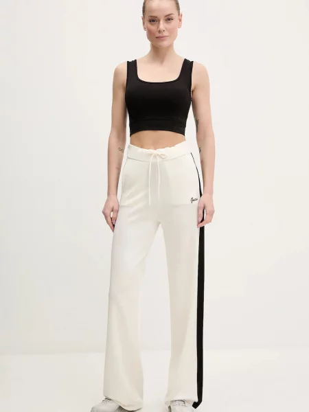 Спортивні штани Guess з аплікацією бежевий