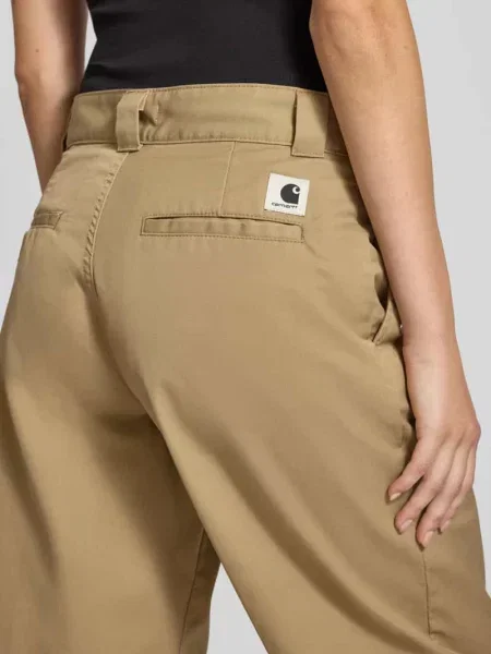 Spodnie materiałowe z wpuszczanymi w stylu francuskim Carhartt Work In Progress beżowe
