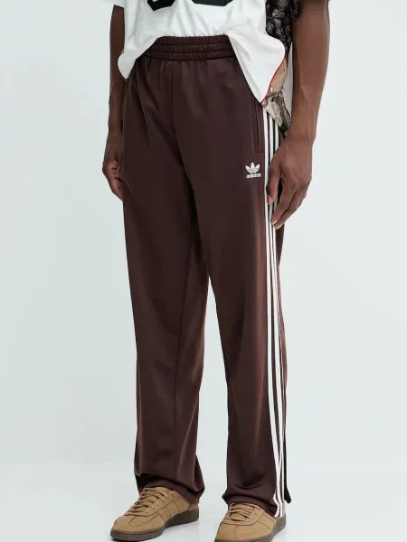 Спортивні штани adidas Originals Firebird Tp з аплікацією коричневий