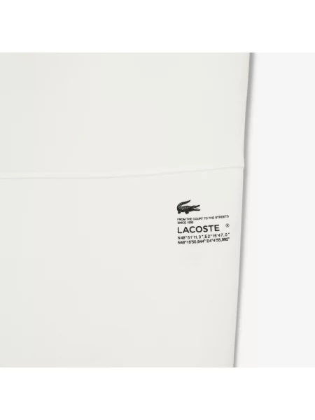 Зауженные спортивные штаны Lacoste белые