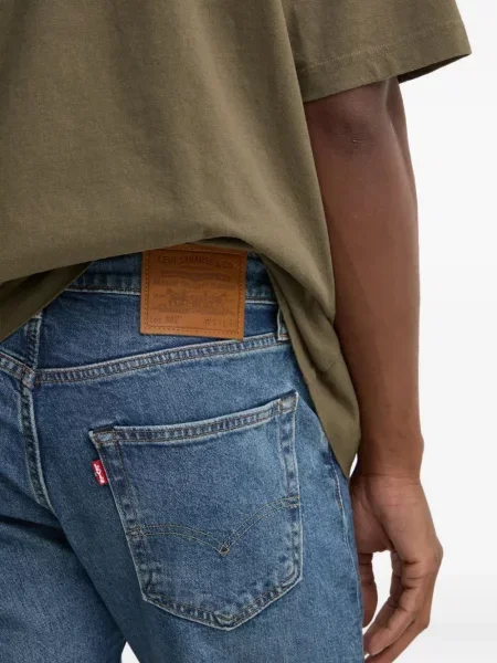 Kožne prugaste traperice Levi's® plava
