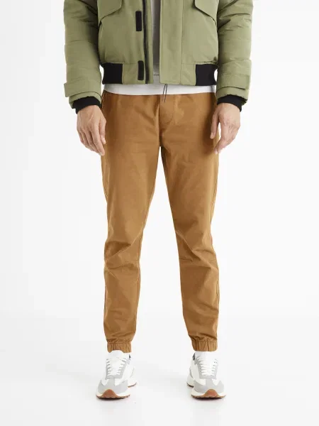 Běžecké kalhoty Celio hnědé