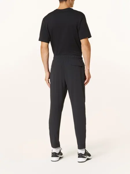 Nike Tréninkové Kalhoty Dri-Fit Unlimited tmavě modrá černé