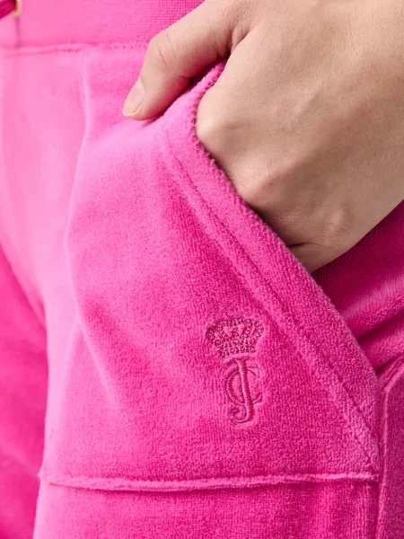 Велюровые спортивные штаны Juicy Couture с низкой посадкой