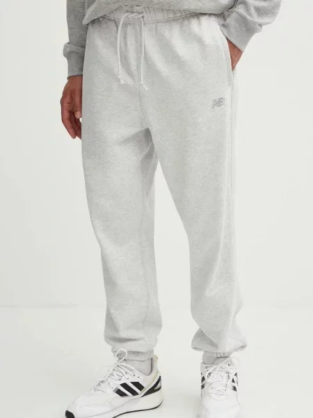 Froté kalhoty jogger New Balance s aplikacemi šedé