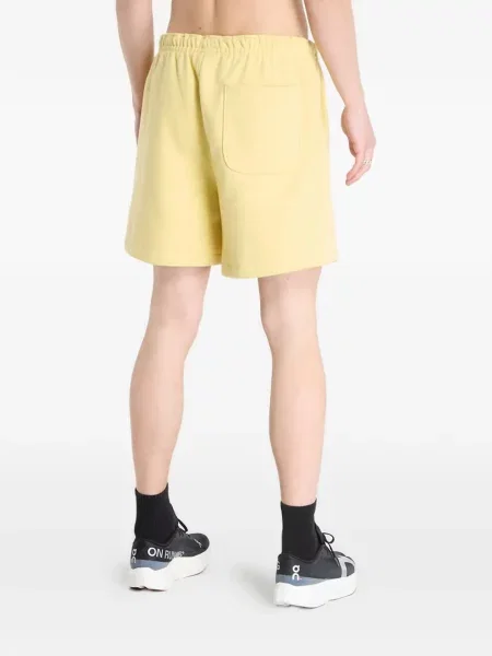 Pantaloni scurți The North Face cu autograf galben