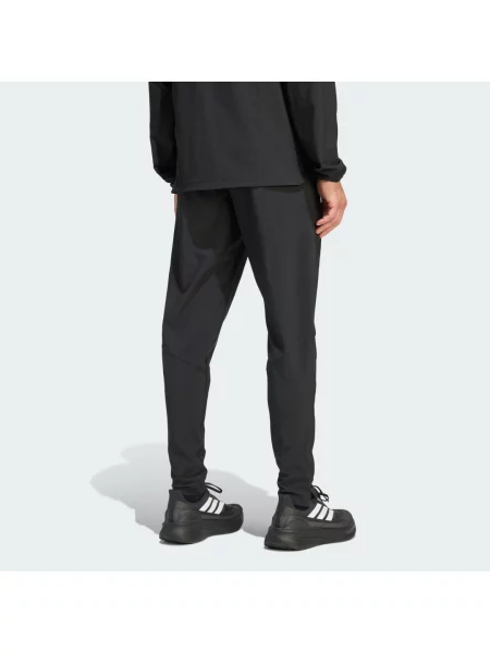 Kalhoty Tiro Travel Woven Pants černé