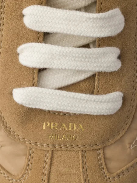 Sneakerși Prada din dantelă