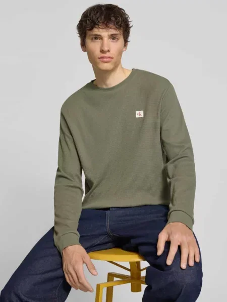Bluzka z długim rękawem o kroju regular fit z mieszanki bawełny Calvin Klein Jeans fioletowa