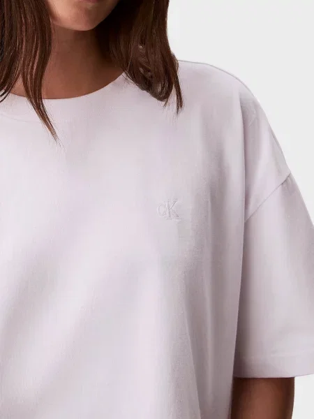 Укорочена футболка Calvin Klein Jeans в квіточку біла