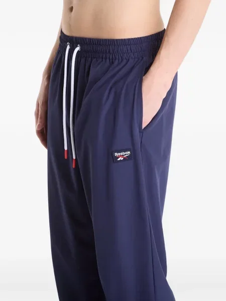 Běžecké kalhoty Reebok s autogramem modré