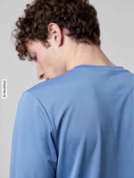 Bluzka z długim rękawem sport o kroju regular fit z okrągłym dekoltem Nike Training niebieska