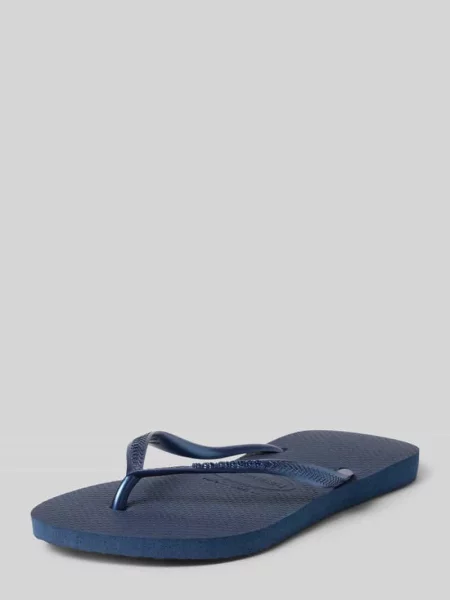 Japonki w wąskim kroju z detal z logo Havaianas granatowe