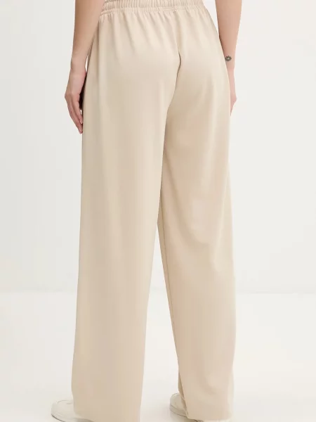 Legginsy Tommy Jeans beżowe
