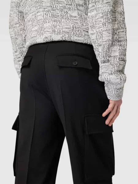 Spodnie cargo o kroju regular fit z wpuszczanymi Filippa K czarne