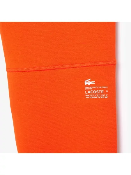 Lacoste Spodnie Zwężane pomarańczowe