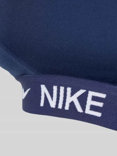 Biustonosz sportowy o kroju slim fit z detalem z logo model Indy' Nike Training granatowy