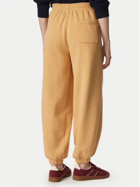 Teplákové kalhoty Tommy Jeans béžové