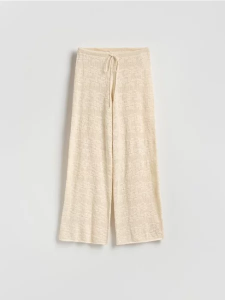 Reserved штани з ажурною вишивкою нюдовий 