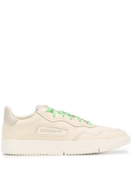 Sneakerși Adidas Pharrell Williams cu șireturi din dantelă