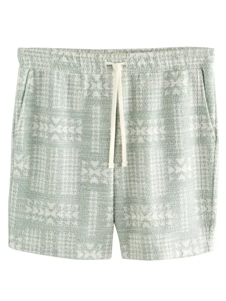 Next Kalhoty pastelově zelená bílá