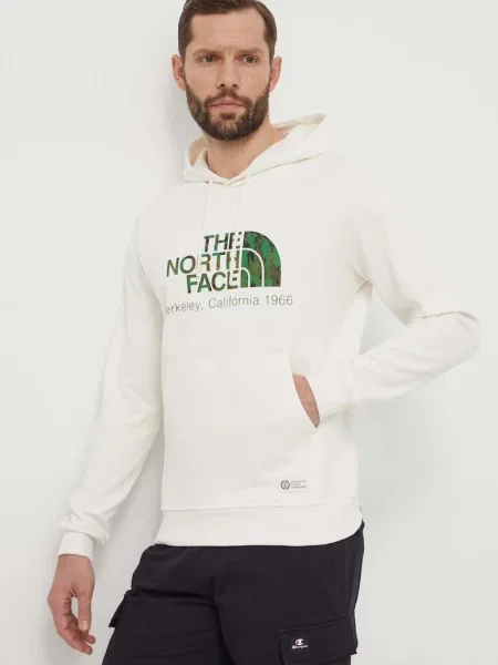 Bombažen pulover The North Face s kapuco bela