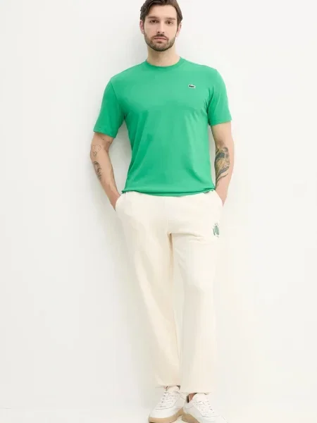 Спортивні штани Lacoste з принтом бежевий