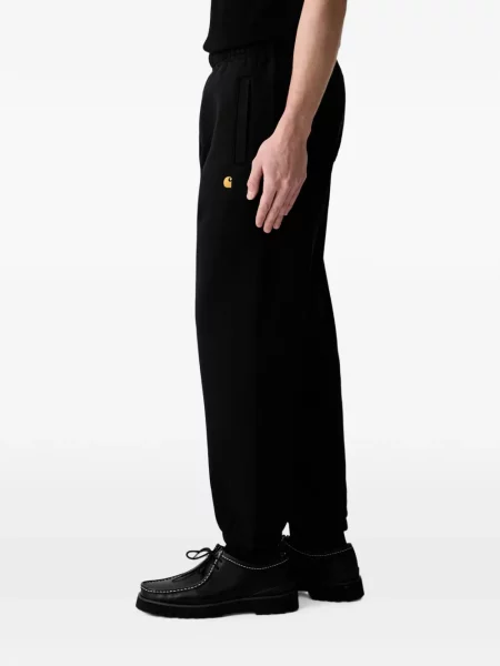 Trčanje hlače Carhartt Wip s autogramom crna