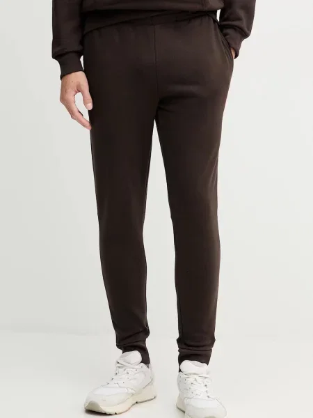 Спортивні штани Lacoste однотонна бежевий