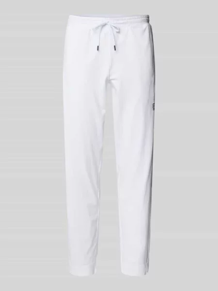 Spodnie treningowe o kroju relaxed fit z fakturowanym wzorem model ‘TENNIS PRO’ Ea7 Emporio Armani białe