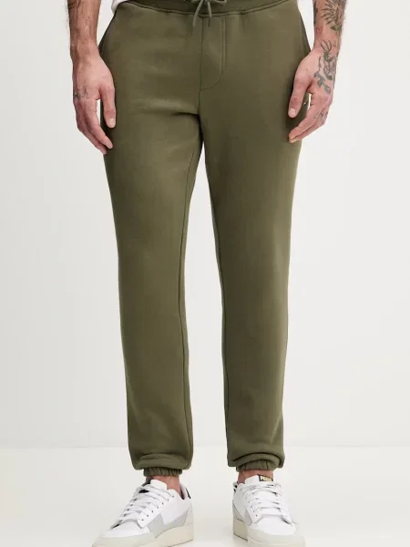 Tepláky Tommy Jeans zelená