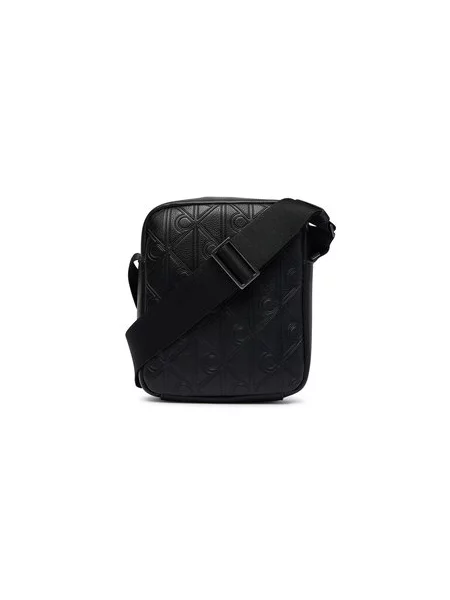 Calvin Klein Torbica za okrog pasu Emblem Aop Deboss Reporter črna