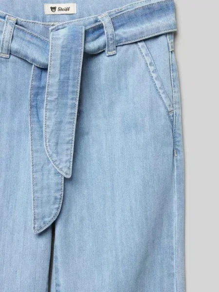 Jeansy o kroju baggy fit z wiązanym paskiem Steiff niebieskie