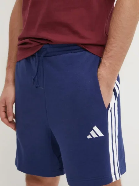 Pantaloni Adidas cu dungi din material terry albastru