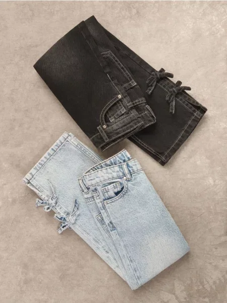 Reserved Jeansy straight z kokardkami niebieski