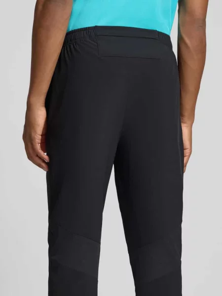 Spodnie treningowe o kroju straight fit z nadruk z logo model Core' Asics czarne
